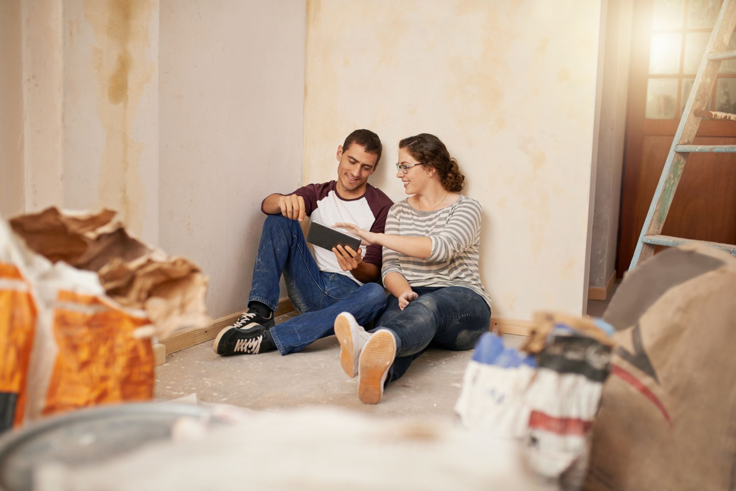 A couple sitting inside a house